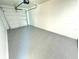 Garage with freshly painted walls and new epoxy flooring at 4732 Lighthouse Cir, Orlando, FL 32808