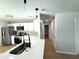 Modern kitchen with island, stainless steel appliances, and white cabinetry at 4732 Lighthouse Cir, Orlando, FL 32808