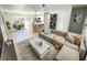 Open living room, kitchen, and dining area with modern furnishings and light flooring at 4732 Lighthouse Cir, Orlando, FL 32808
