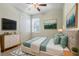 Bedroom with a bed, TV stand and neutral decor at 4838 Southlawn Ave, Orlando, FL 32811