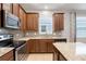 Modern kitchen with stainless steel appliances and granite countertops at 4838 Southlawn Ave, Orlando, FL 32811