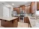 Modern kitchen with stainless steel appliances and granite countertops at 4838 Southlawn Ave, Orlando, FL 32811