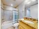 Clean bathroom boasts a tub, shower, and granite vanity at 5 Riverwalk Dr # 503, New Smyrna Beach, FL 32169