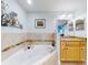 Bathroom with corner soaking tub and double vanity at 5 Riverwalk Dr # 503, New Smyrna Beach, FL 32169