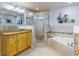 Spa-like bathroom with double vanity, corner tub, and shower at 5 Riverwalk Dr # 503, New Smyrna Beach, FL 32169