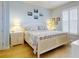 King bedroom with coastal decor and plenty of natural light at 5 Riverwalk Dr # 503, New Smyrna Beach, FL 32169