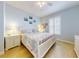 Bright bedroom with a king-size bed and white shutters at 5 Riverwalk Dr # 503, New Smyrna Beach, FL 32169