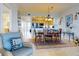 Condo dining area with wood table, chairs, and kitchen views at 5 Riverwalk Dr # 503, New Smyrna Beach, FL 32169