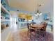 Condo dining area with wood table, chairs, and kitchen views at 5 Riverwalk Dr # 503, New Smyrna Beach, FL 32169