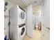 Stackable washer and dryer in a dedicated laundry room at 5 Riverwalk Dr # 503, New Smyrna Beach, FL 32169