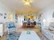 Open concept living and dining area with access to kitchen at 5 Riverwalk Dr # 503, New Smyrna Beach, FL 32169