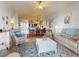 Open concept living and dining area with access to kitchen at 5 Riverwalk Dr # 503, New Smyrna Beach, FL 32169