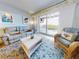 Bright living room with water views, comfy seating, and tasteful decor at 5 Riverwalk Dr # 503, New Smyrna Beach, FL 32169
