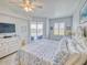 Main bedroom with king bed, dresser, and balcony access at 5 Riverwalk Dr # 503, New Smyrna Beach, FL 32169