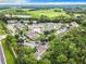 Aerial view of community with pool, tennis court, and condos at 5003 Laguna Bay Cir # 16, Kissimmee, FL 34746