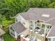 An aerial view of this condo, showing the exterior with its multiple balconies and lush green surroundings at 5003 Laguna Bay Cir # 16, Kissimmee, FL 34746