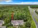 Aerial view showing condo location near a highway and forest at 5003 Laguna Bay Cir # 16, Kissimmee, FL 34746