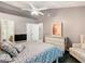 Bedroom with a dresser, ceiling fan, and large bed at 5003 Laguna Bay Cir # 16, Kissimmee, FL 34746