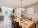 Bright dining room with a wood table and chairs, kitchen view at 5003 Laguna Bay Cir # 16, Kissimmee, FL 34746