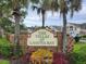 The Villas at Laguna Bay entrance sign with landscaping at 5003 Laguna Bay Cir # 16, Kissimmee, FL 34746