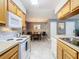 Open concept kitchen with island and view into dining area at 5003 Laguna Bay Cir # 16, Kissimmee, FL 34746
