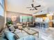 Open concept living room and kitchen with vaulted ceiling at 5003 Laguna Bay Cir # 16, Kissimmee, FL 34746