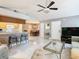 Open living area with kitchen, dining, and ample natural light at 5003 Laguna Bay Cir # 16, Kissimmee, FL 34746