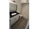 Clean bathroom, granite countertop and bathtub shower at 5587 Devonbriar Way # 104, Orlando, FL 32822