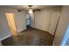 Spacious bedroom with wood-look floors and access to bathroom at 5587 Devonbriar Way # 104, Orlando, FL 32822