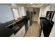 Modern kitchen with stainless steel appliances and granite countertops at 5587 Devonbriar Way # 104, Orlando, FL 32822