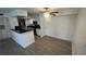 Modern kitchen with white cabinets and granite countertops at 5587 Devonbriar Way # 104, Orlando, FL 32822