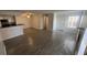 Open concept living room with tile floors and kitchen access at 5587 Devonbriar Way # 104, Orlando, FL 32822
