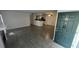 Bright living room with tile floors, fireplace, and access to patio at 5587 Devonbriar Way # 104, Orlando, FL 32822