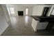 Open living room with kitchen, fireplace and patio access at 5587 Devonbriar Way # 104, Orlando, FL 32822
