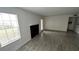 Living room with tile floors, fireplace and large windows at 5587 Devonbriar Way # 104, Orlando, FL 32822