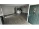 Bright living room with tile floors, fireplace, and access to patio at 5587 Devonbriar Way # 104, Orlando, FL 32822