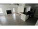 Open living room with kitchen, fireplace and patio access at 5587 Devonbriar Way # 104, Orlando, FL 32822