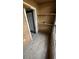 Private screened patio with wood-look tile floor at 5587 Devonbriar Way # 104, Orlando, FL 32822