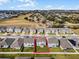 Aerial view of a house and surrounding neighborhood at 673 Blackstone St, Minneola, FL 34715