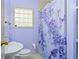 Bathroom with shower/tub and floral shower curtain at 719 Mayfair Cir, Orlando, FL 32803