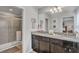 Bathroom with granite countertops and a walk-in shower at 8857 Rhodes St, Kissimmee, FL 34747