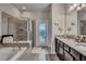 Spa-like bathroom with a large soaking tub and walk-in shower at 8857 Rhodes St, Kissimmee, FL 34747