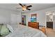 Bedroom with king-size bed and en-suite bathroom access at 8857 Rhodes St, Kissimmee, FL 34747