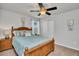 Bedroom with a full-size bed and nightstand at 8857 Rhodes St, Kissimmee, FL 34747