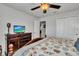 Bedroom with king bed, dresser, and access to hallway at 8857 Rhodes St, Kissimmee, FL 34747