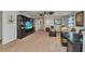 Multipurpose bonus room with a sectional sofa and large TV at 8857 Rhodes St, Kissimmee, FL 34747