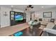 Bonus room with comfortable seating area and large TV at 8857 Rhodes St, Kissimmee, FL 34747