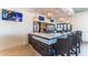 Community bar with granite countertop, stylish pendant lighting, and wicker barstools at 8857 Rhodes St, Kissimmee, FL 34747