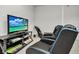 Game room with two chairs, TV, and golf clubs at 8857 Rhodes St, Kissimmee, FL 34747