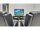Game room with two gaming chairs and large TV at 8857 Rhodes St, Kissimmee, FL 34747